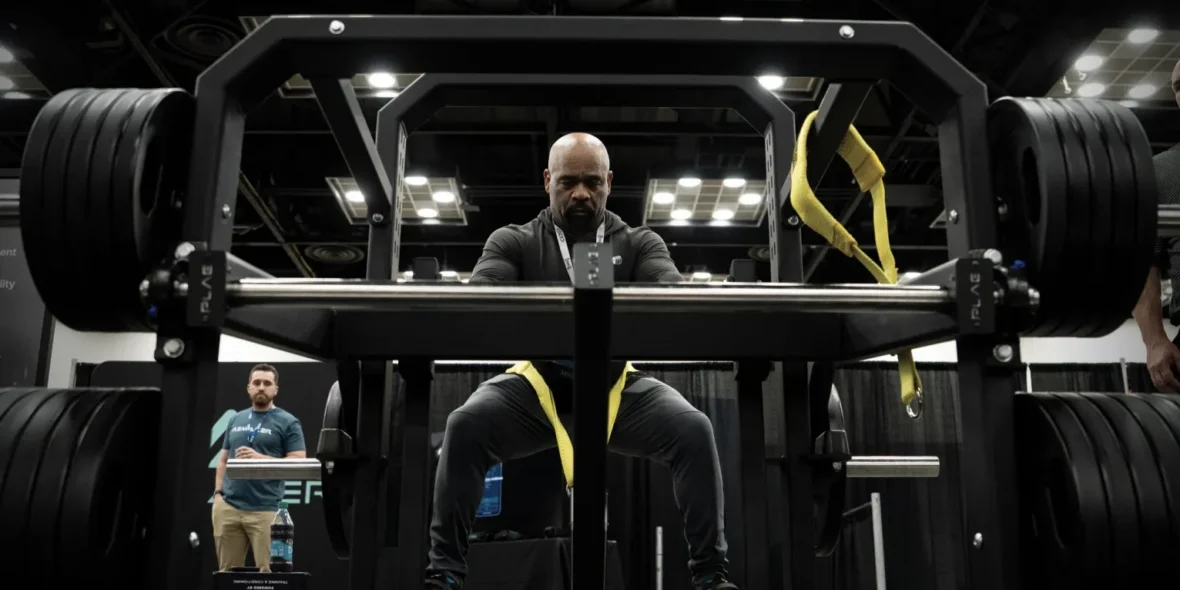 A man testing out the new ARMR plate-loaded machine from PLAE.